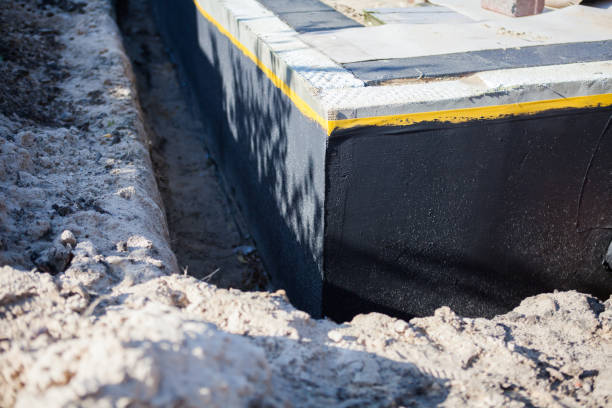 Professional Basement Waterproofing technician working in Carleton, MI